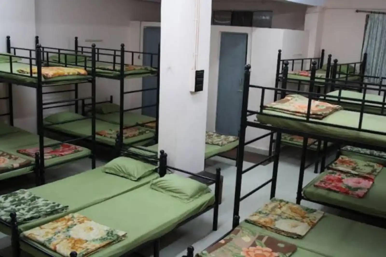 Dormitory bed facility at Gagangiri Ashram for pilgrims and groups